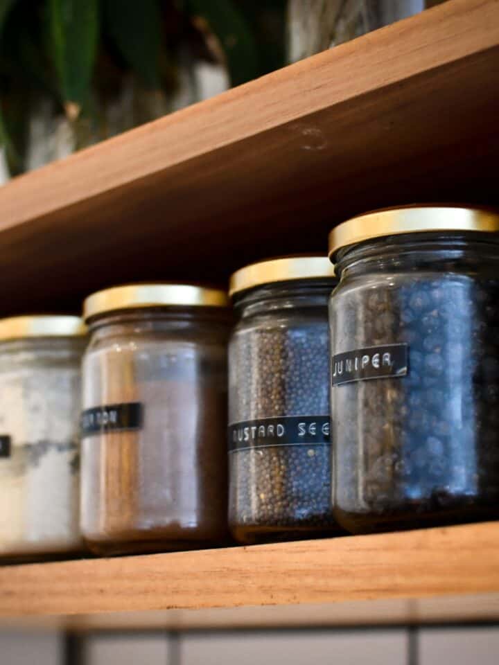 Shelf with glass spice jars.