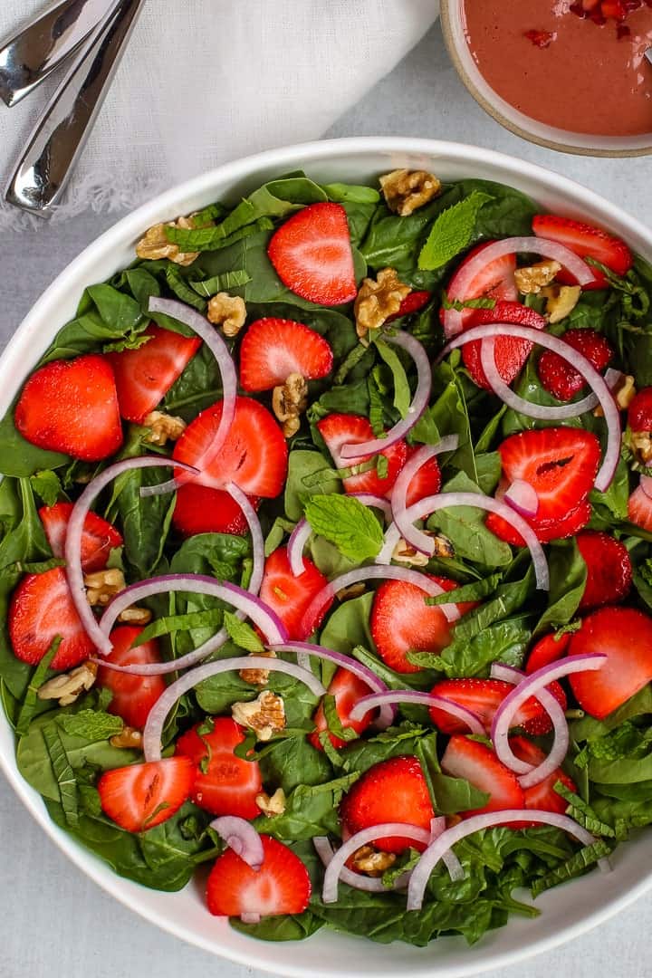 Strawberry walnut salad in a bowl.