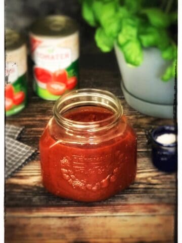 Jar of homemade marinara sauce.