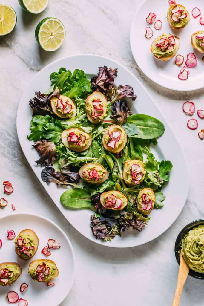 Vegan stuffed potatoes on a plate.