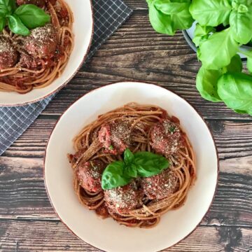 Vegan spaghetti and meatballs in two bowls.