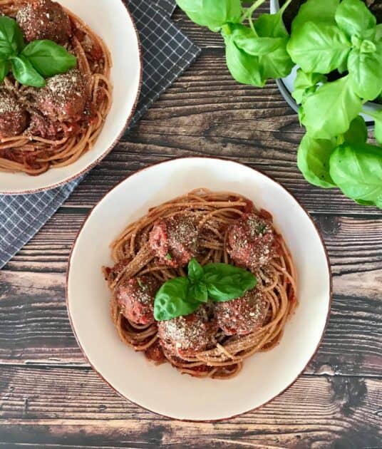 Vegan spaghetti and meatballs in two bowls.