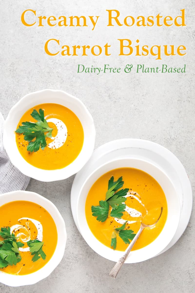 Carrot bisque in three bowls.