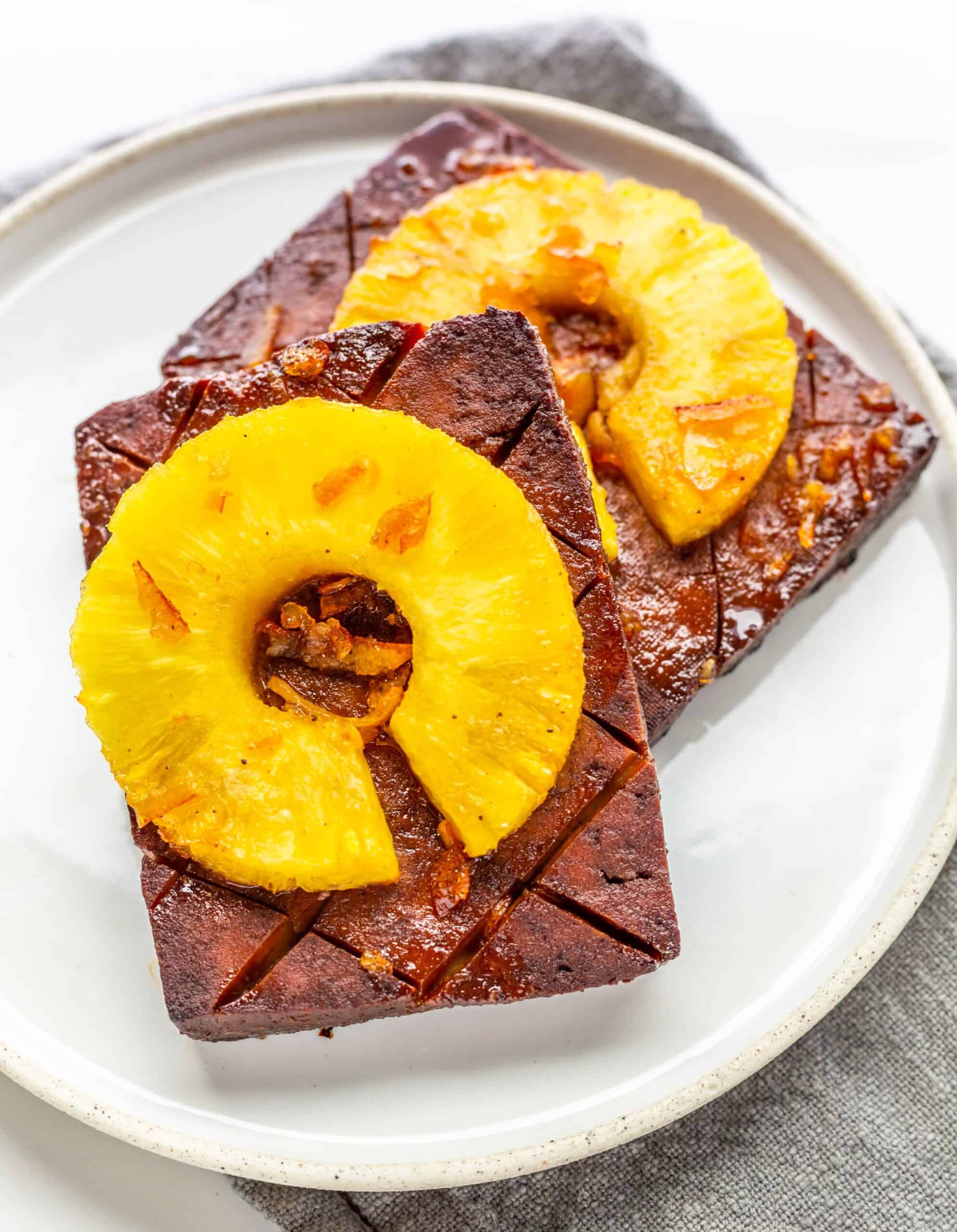 Tofu ham topped with pineapple rings.