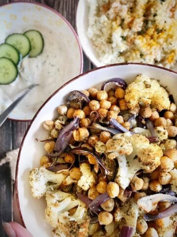 Sheet pan cauliflower and chickpeas in a bowl.