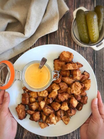 Chick-fil-A tofu on a plate with vegan honey mustard.