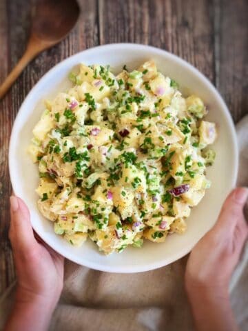 Bowl of creamy vegan potato salad.