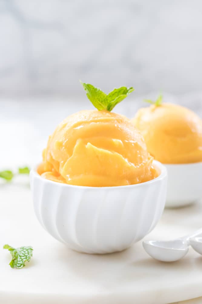 Two bowls of mango sorbet.