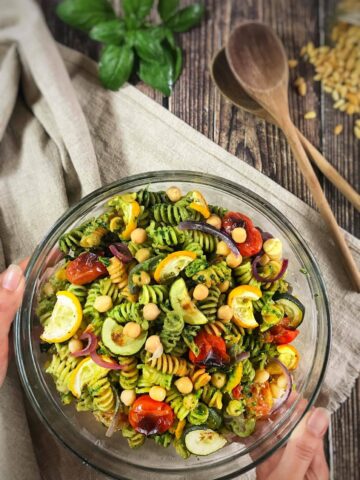 Vegan pesto pasta salad in a bowl.