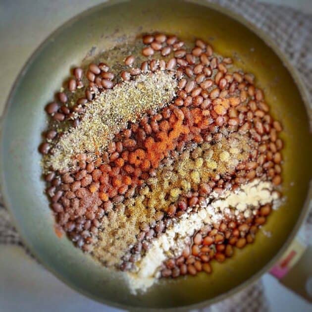 Black beans and seasonings in a skillet.