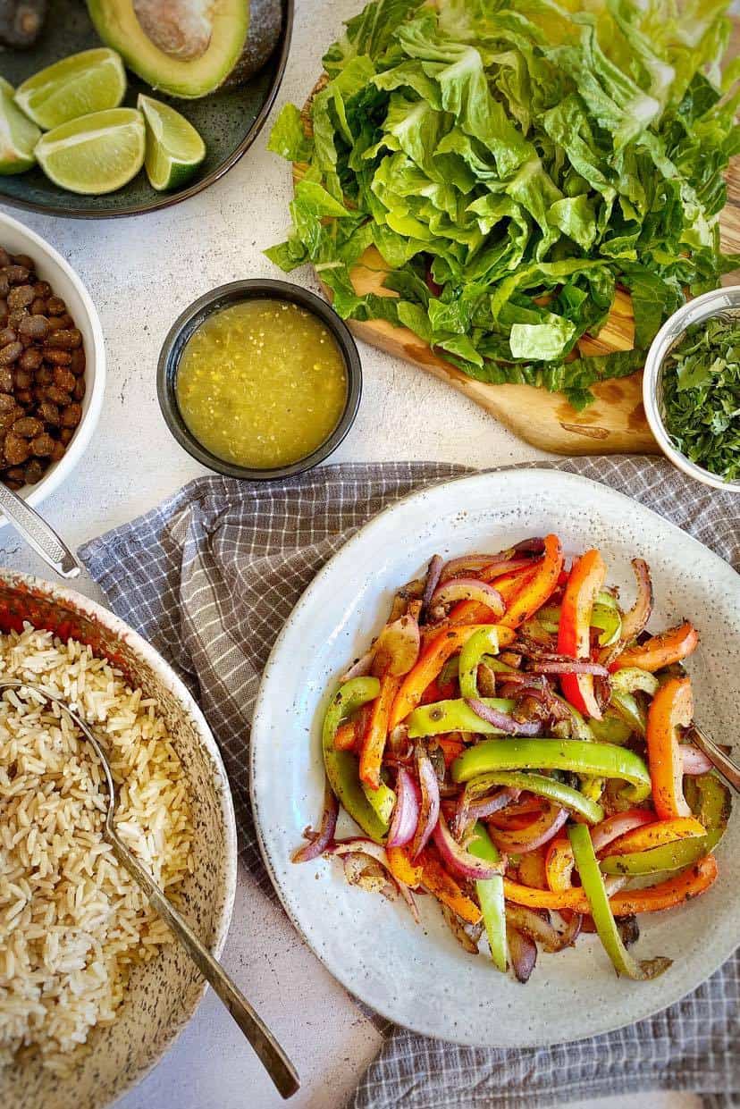 Cooked ingredients for black bean burrito bowls.