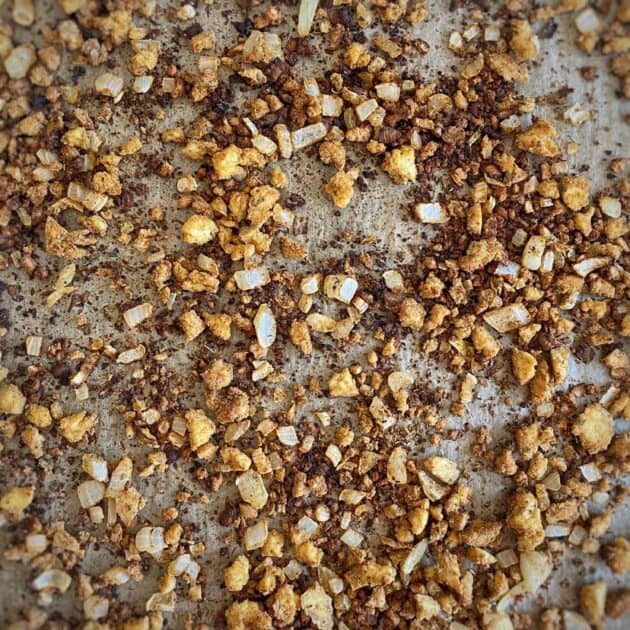 Crumbled tofu on a baking sheet.