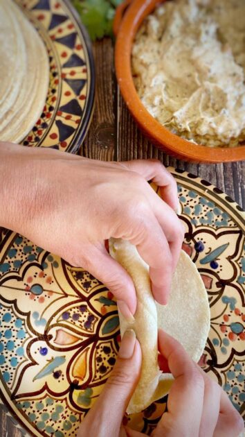 Hand rolling tofu taquito.