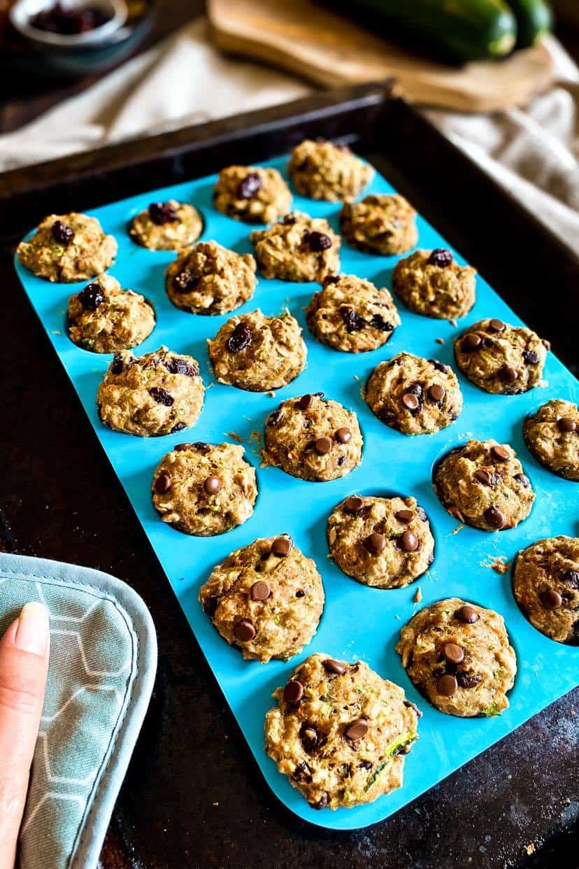 Vegan zucchini muffins in a silicone muffin pan.