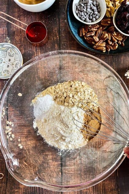 Dry ingredients for vegan zucchini muffins in a bowl.