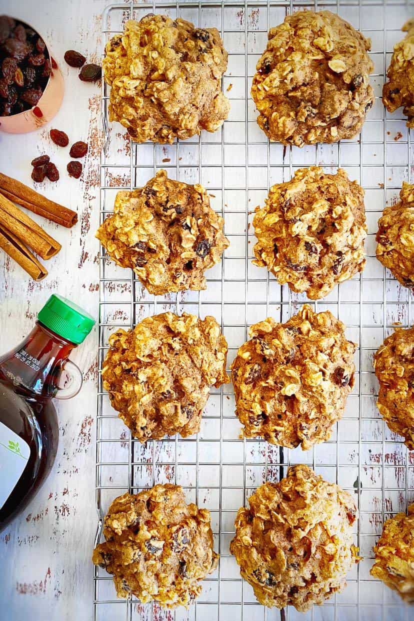 Vegan oatmeal raisin cookies in a drying rack.