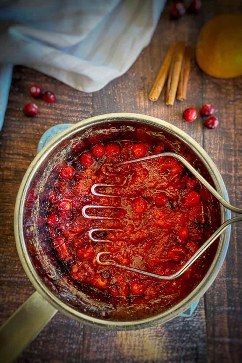 Mash the cranberries.