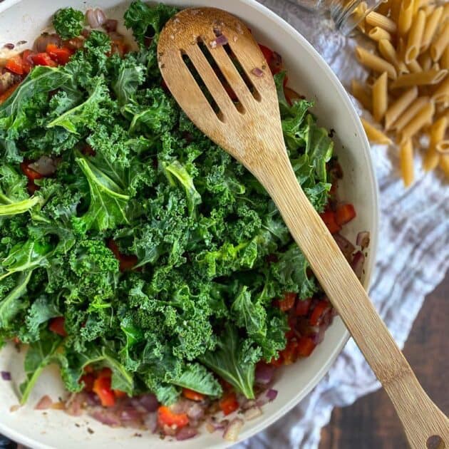 Kale added to the skillet.