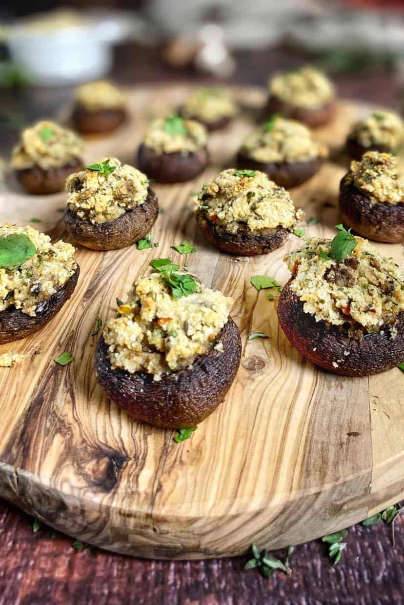 Vegan stuffed mushrooms on a cutting board.