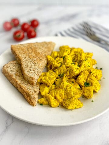 Tofu scramble on a plate with toast.