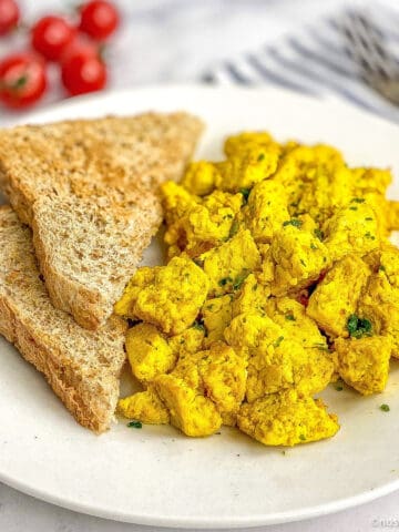 Tofu scramble on a plate with toast.