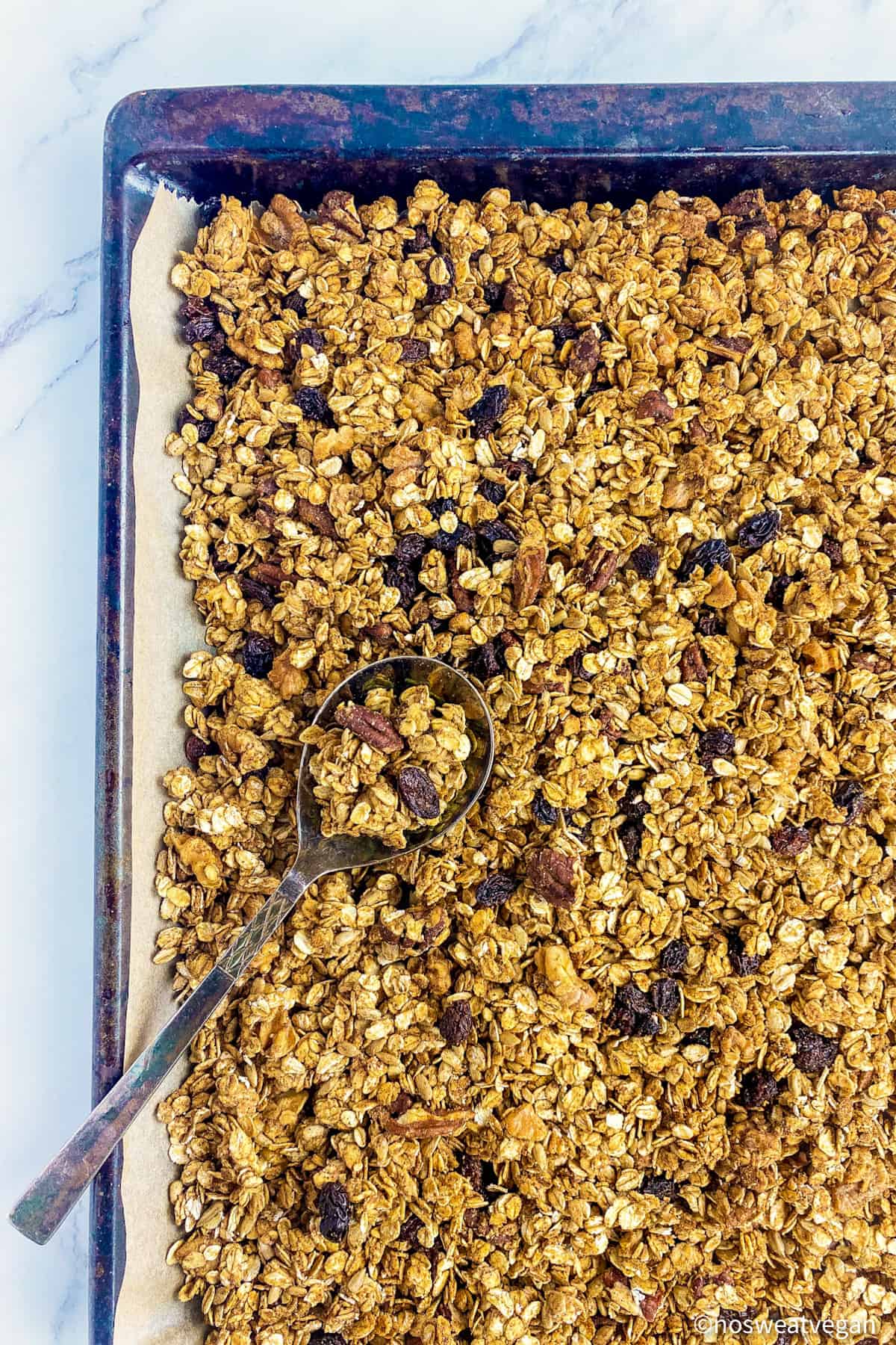Vegan granola cooked on a baking sheet.