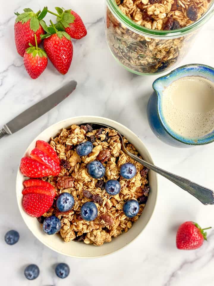 Vegan granola in a bowl with berries.