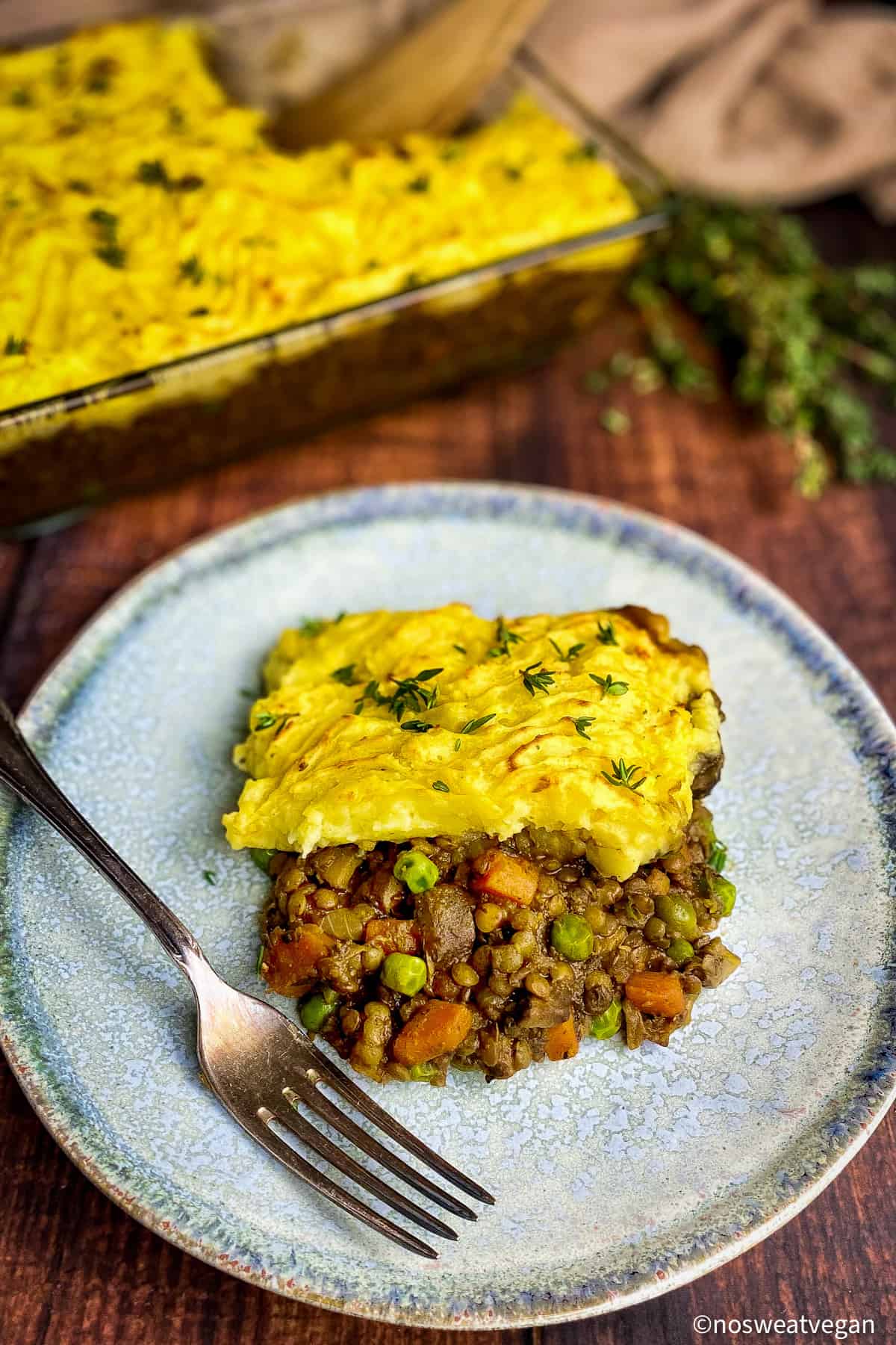 A portion of lentil shepherd's pie on a plate.
