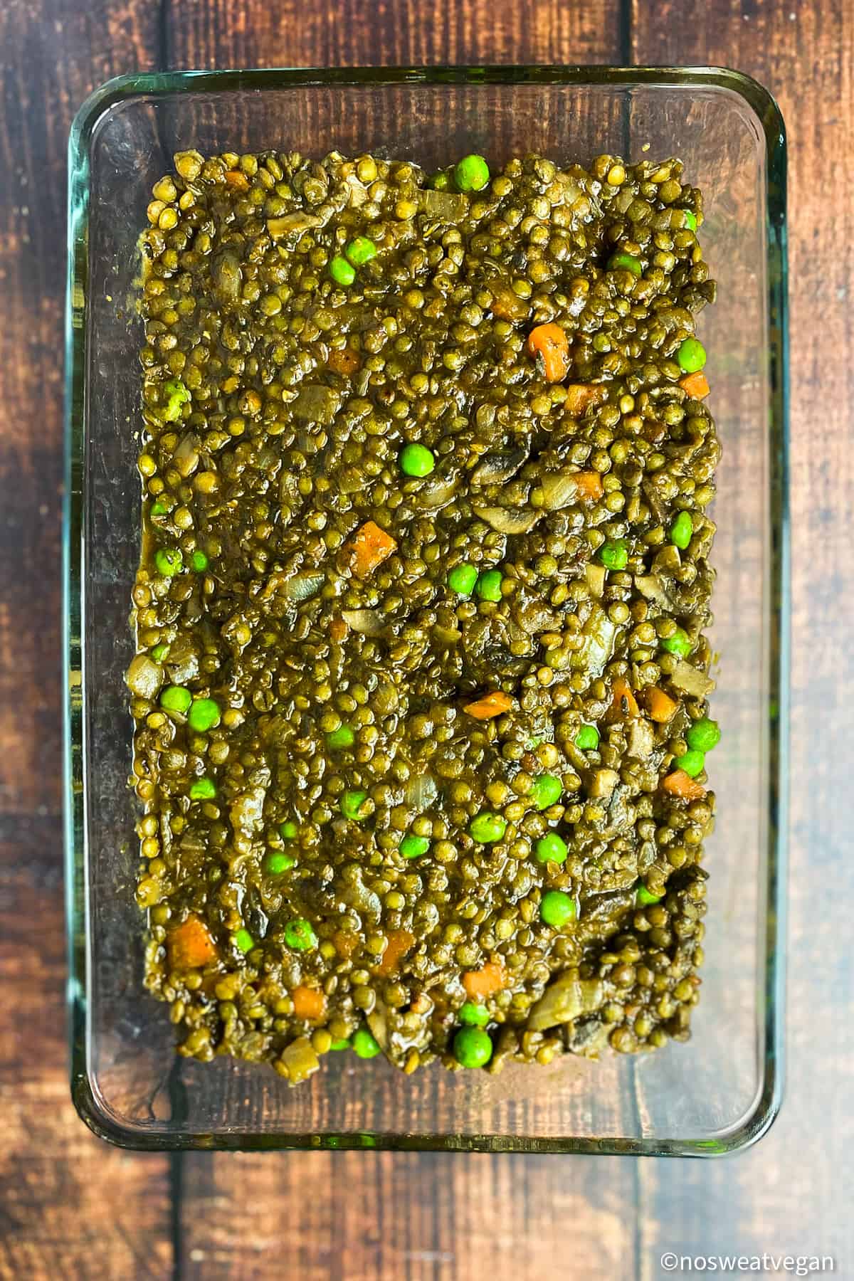 Lentil and vegetable mixture in a baking dish.