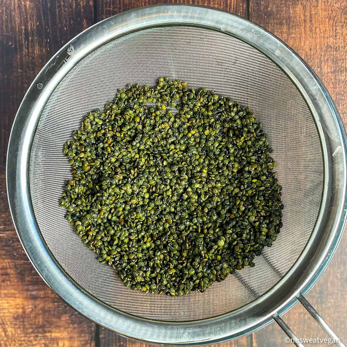 Lentils in a mesh strainer.