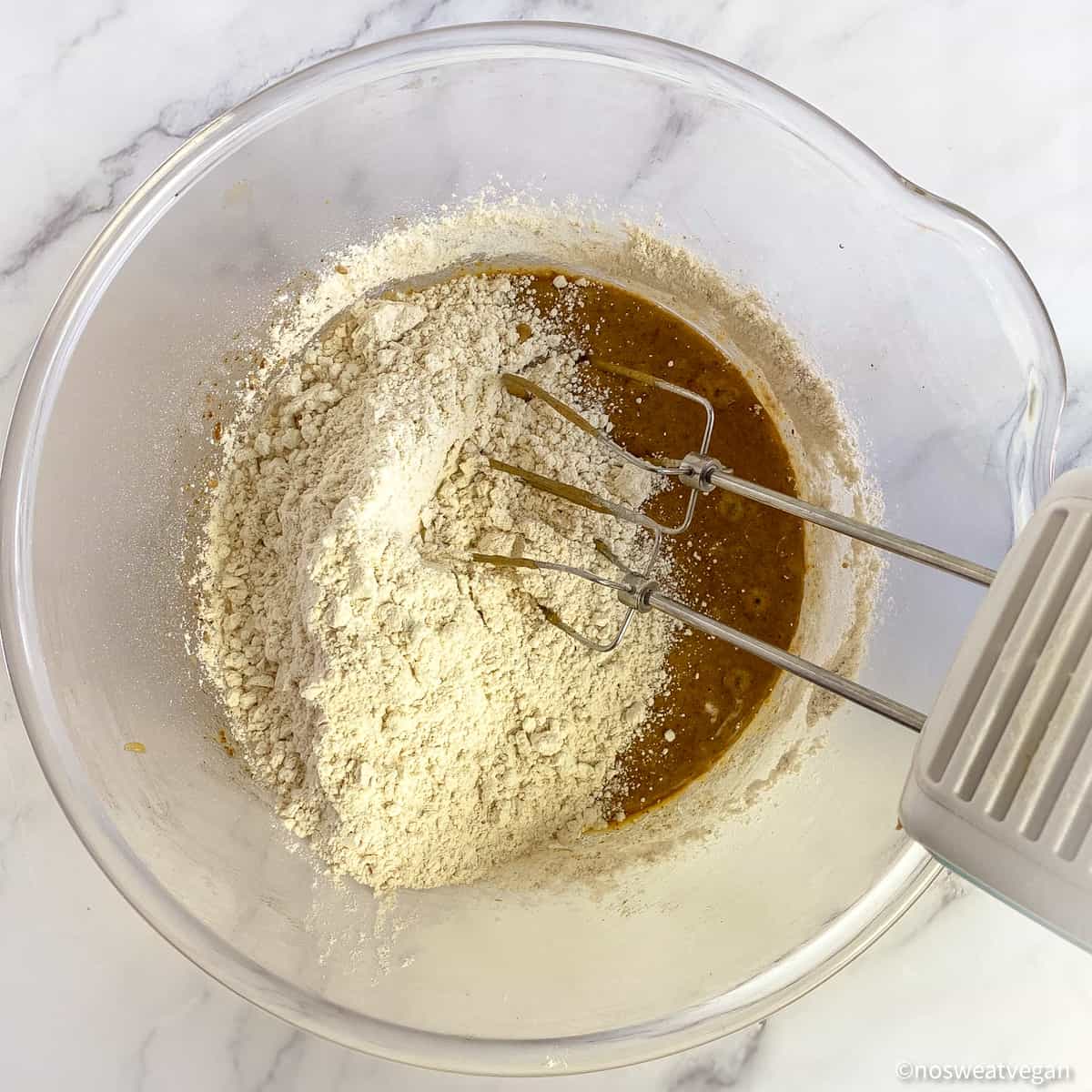 Mix the flour into the wet ingredients.