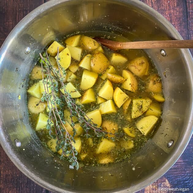 Add diced potatoes and broth to the pot.
