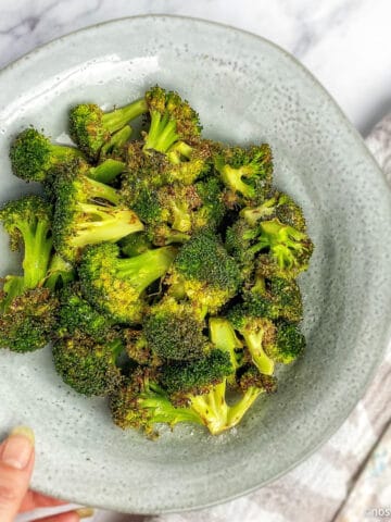 Air fryer broccoli in bowl.
