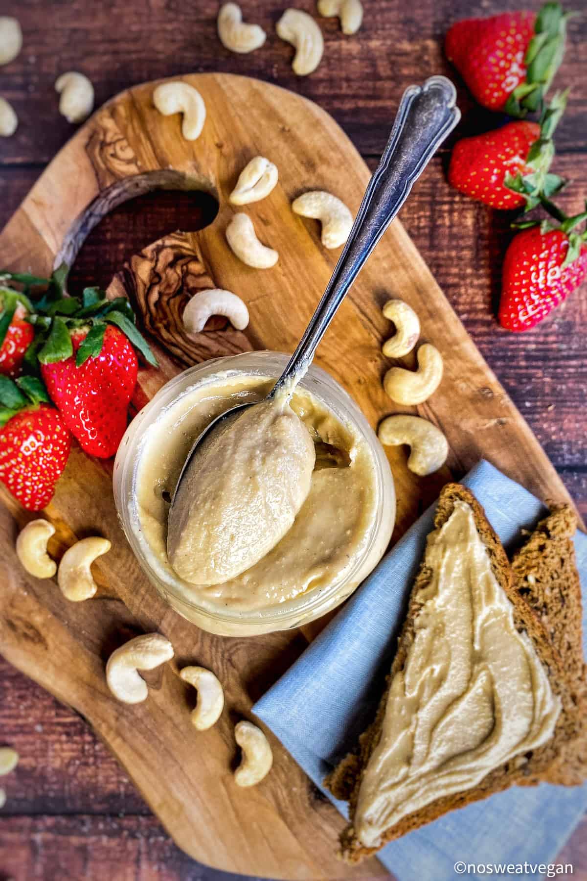 Creamy cashew butter with toast and strawberries.