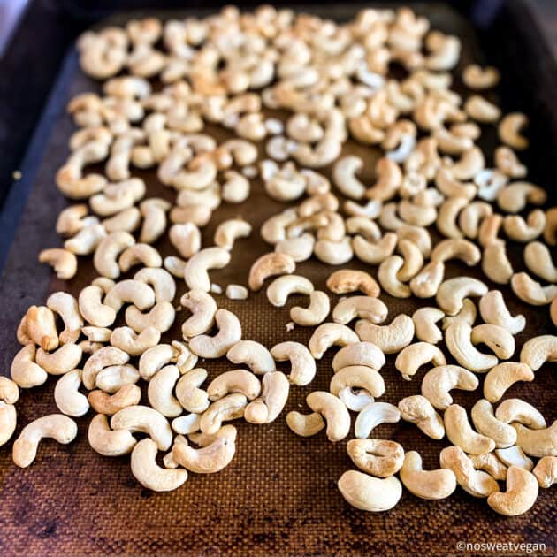 Cashews on a baking sheet.