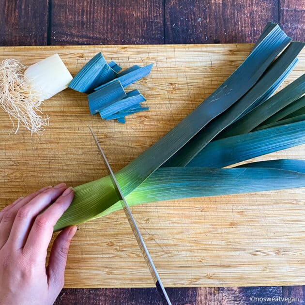 Trim the top and bottom of the leeks.