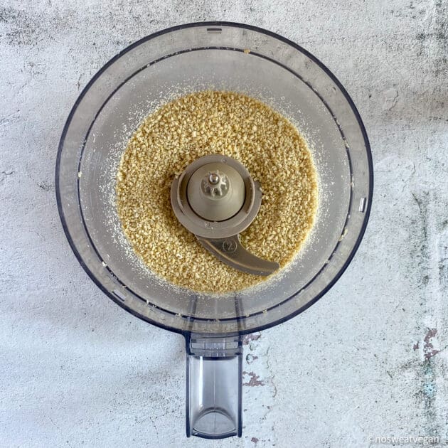 Cashews processed into a coarse meal.