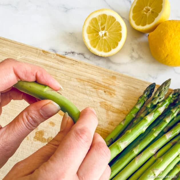 Snap off the woody end of the asparagus.