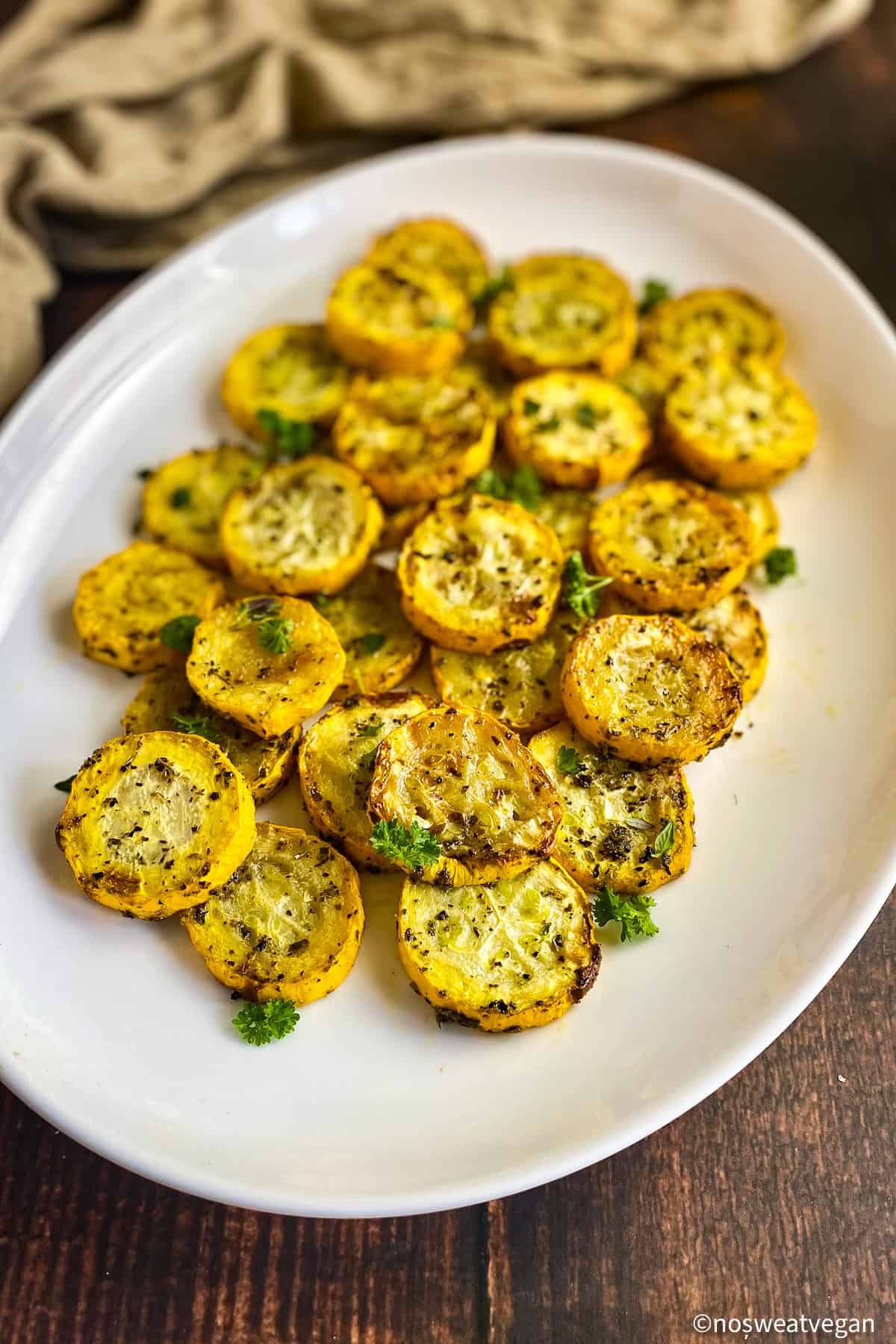 Air fryer summer squash on a plate.