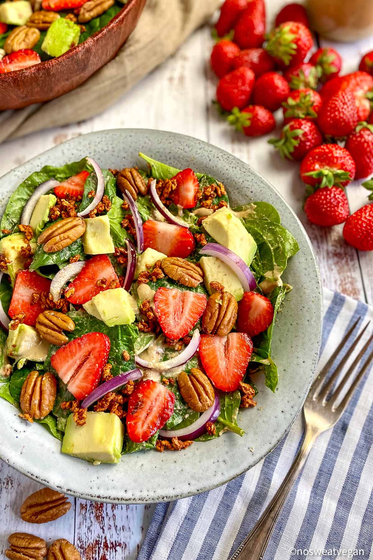 Bowl with spinach avocado salad.