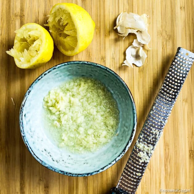 Minced garlic in lemon juice in a bowl.