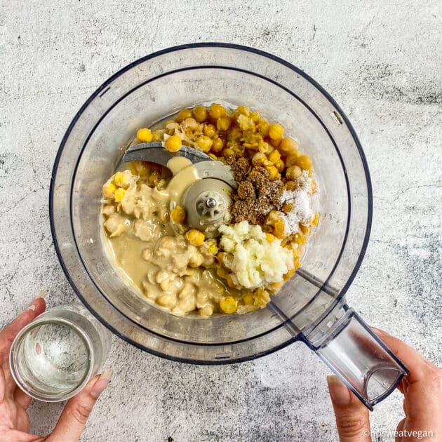 Oil-free hummus ingredients in a food processor.