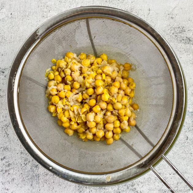 Boiled chickpeas in a colander.