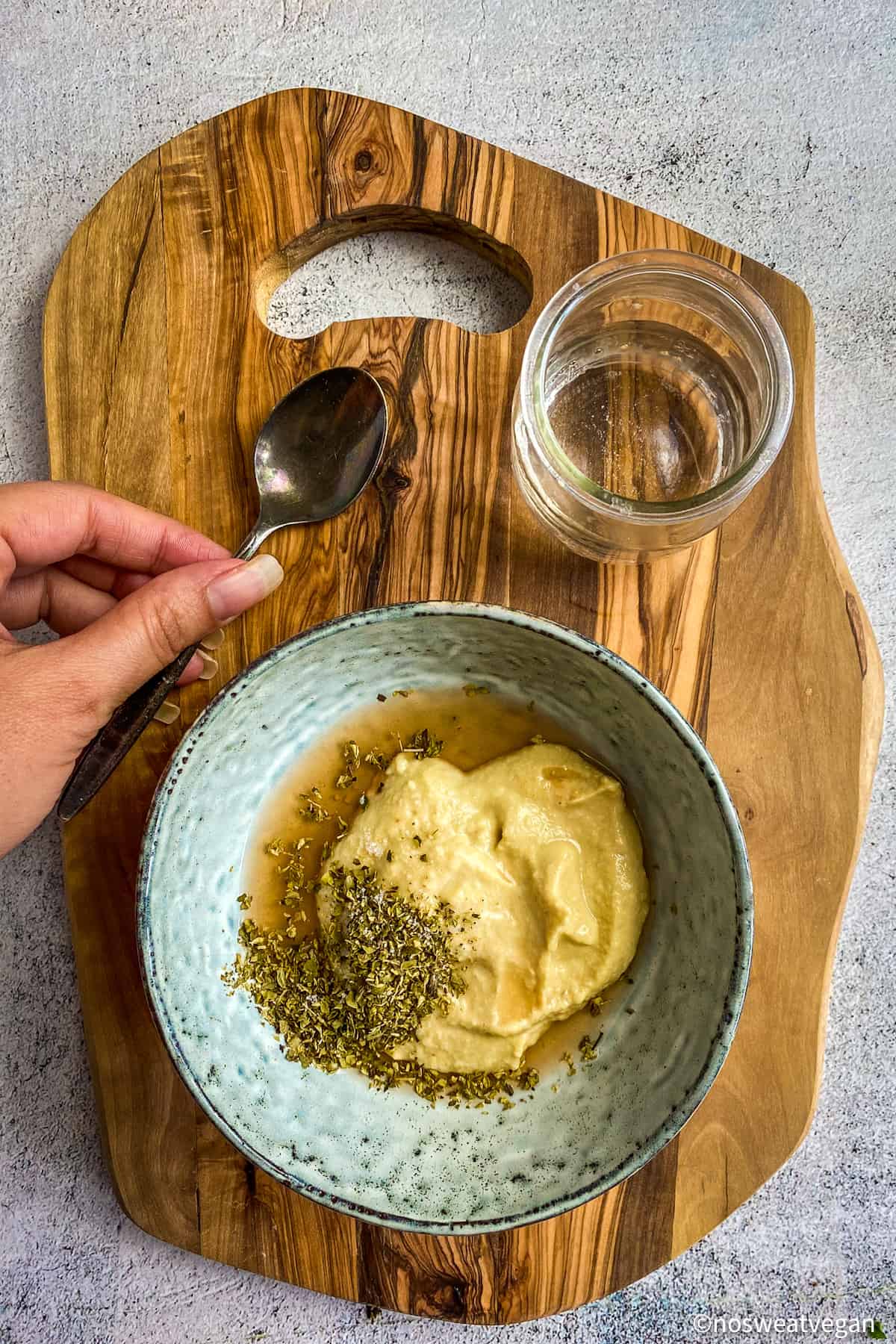 Ingredients for hummus salad dressing in bowl, unmixed.