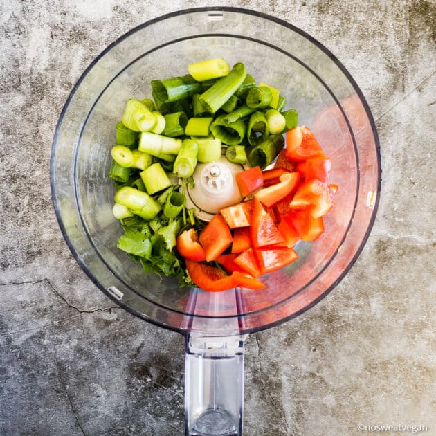 Red pepper, green onion, and cilantro in food processor.
