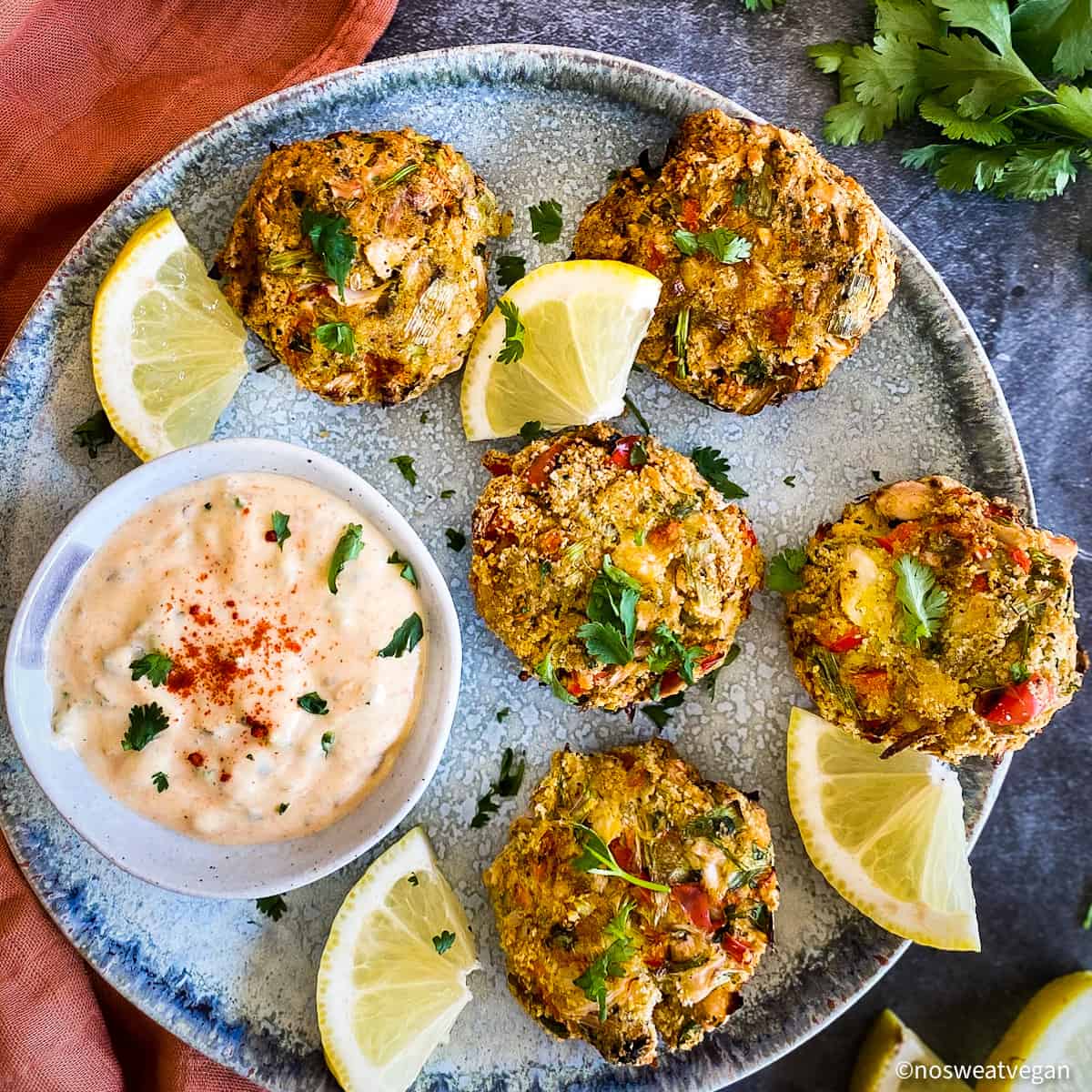 Vegan remoulade on plate with vegan crab cakes.