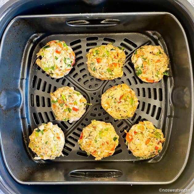 Vegan crab cakes uncooked in air fryer.