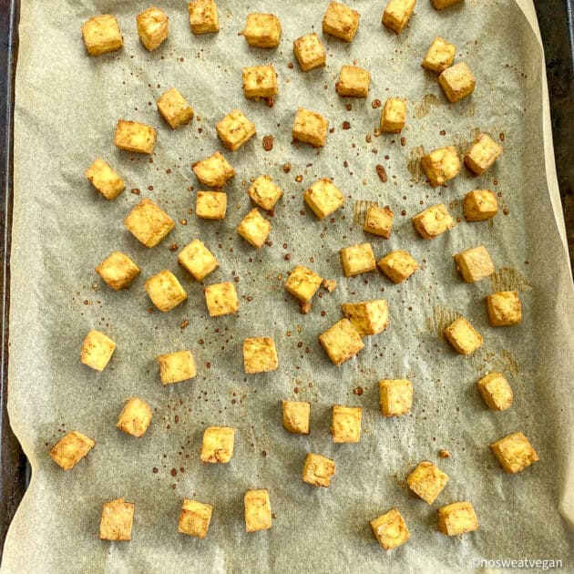Cubed tofu on baking sheet (cooked).