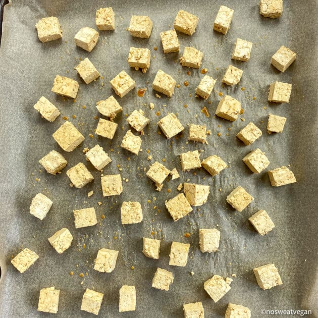 Cubed tofu on baking sheet (uncooked).