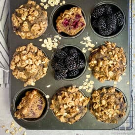Vegan blackberry muffins in pan.